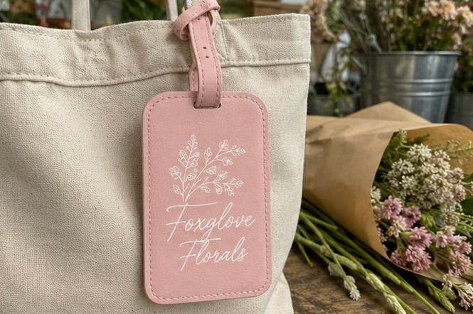 Debossed vegan leather luggage tag with brand logo, cruelty-free PU material